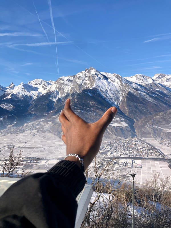 Snow-capped Mountains and hand. Photo by Campeian Gomes