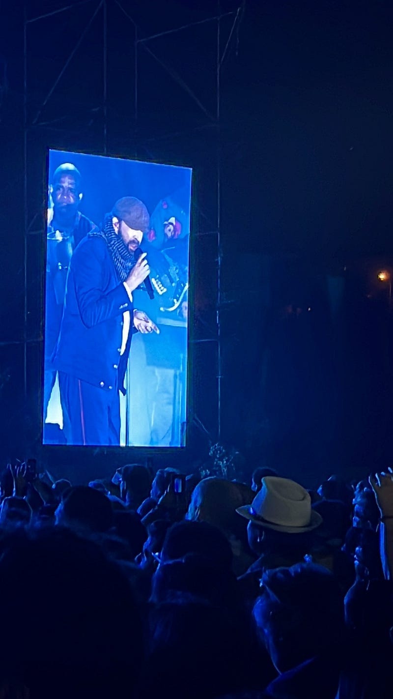 Screen of man singing in concert